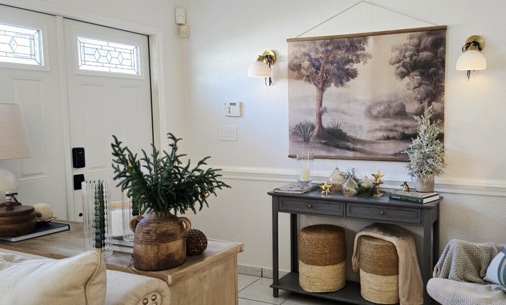 Foyer entryway wall sconces and moody painting