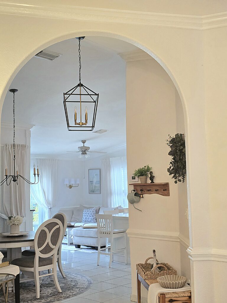 Archway, crown molding and chair rail architecture and dining and family room view